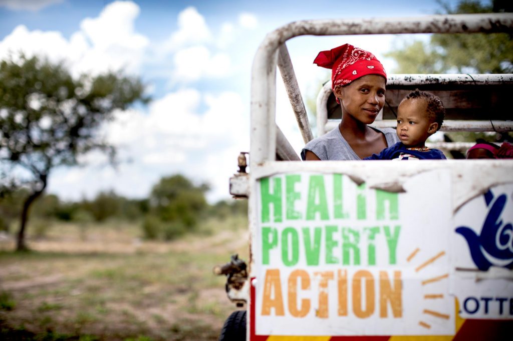 A pregnant mother and her baby travel in a donkey ambulance in Namibia