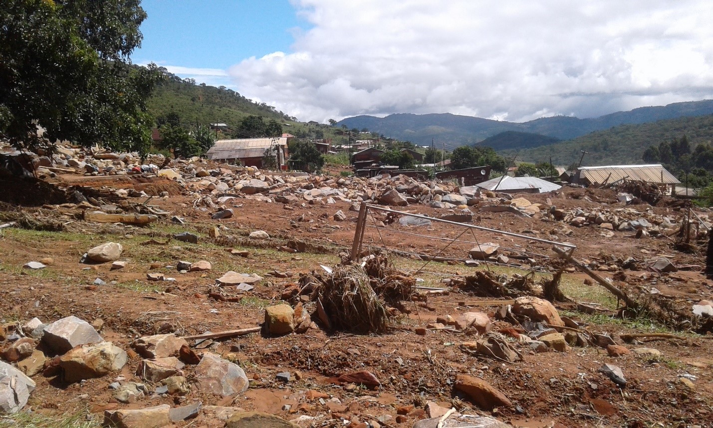 Temporary shelter has been erected where houses used to stand