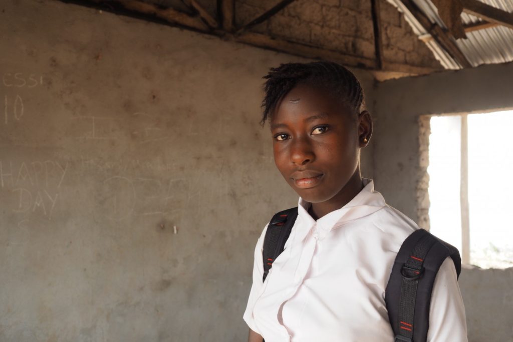 Marian stands in her classroom